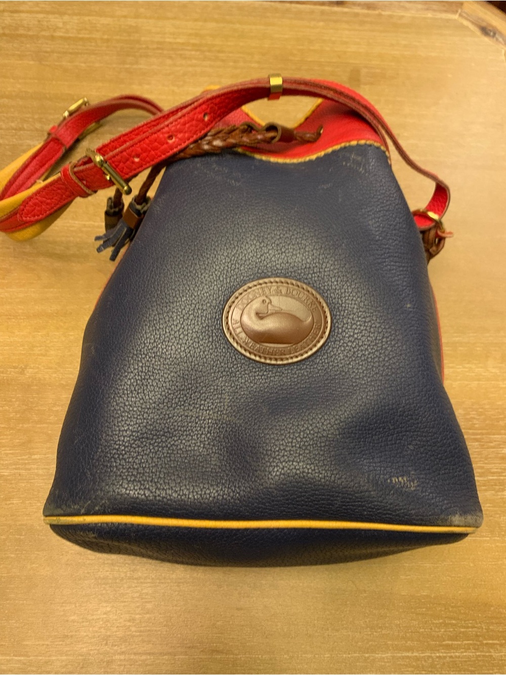 Dooney & Bourke Navy, Red & Yellow Leather Drawstring Bucket Bag - Picture 10 of 16